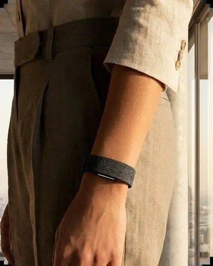 Human Band worn on the wrist beneath a linen sleeve — metabolic capacity tracking during everyday life